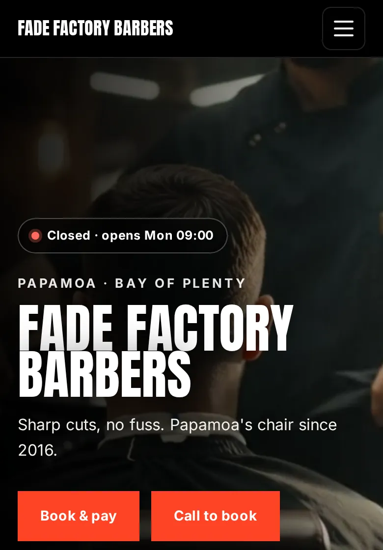 Bold style barbershop website on a phone: heavy black type and bright red buttons